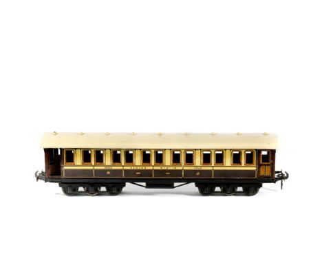 A Gauge One Railway 1920s Carette for Bassett-Lowke tinplate LNWR 12-wheel Dining Car. An example in chocolate and cream with