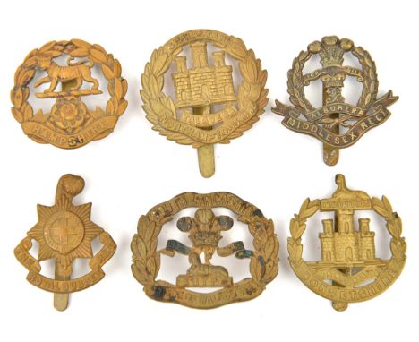 6 WWI all brass cap badges: R Sussex, Hampshire, Dorsetshire, S Lancs, Northants and Middlesex. GC 