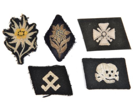 4 various Third Reich silk embroidered cloth patches:  SS death’s head collar patch, Odel rune on black patch, edelweiss on s