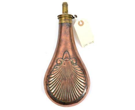 A large shell embossed copper powder flask,  10” overall, the patent top stamped “Patent”, GC (the seam slightly split with t