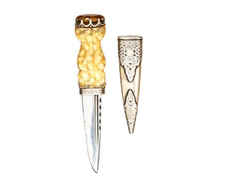 A silver mounted skean dhu, blade 3¾”, with narrow fullers and scalloped back edge, strapwork ivory hilt with engraved silver