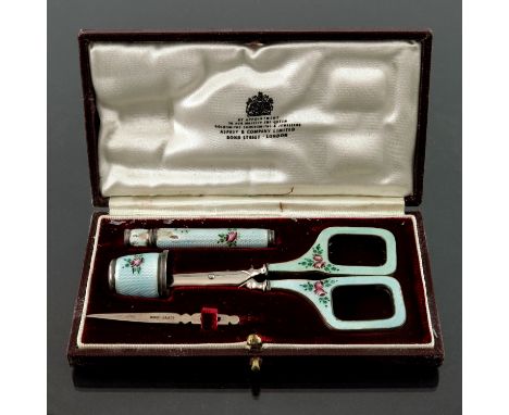 Asprey &amp; Co, London, a cased silver and turquoise guilloche enamel sewing set, including scissors, needle case, needle an