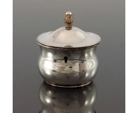 A George III Old Sheffield Plate tea caddy, circa 1780, ogee bombe form with domed hinged lid and carved ivory acorn finial, 