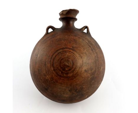 A 15th century ceramic costrell, circular with twin handles, 22cm high