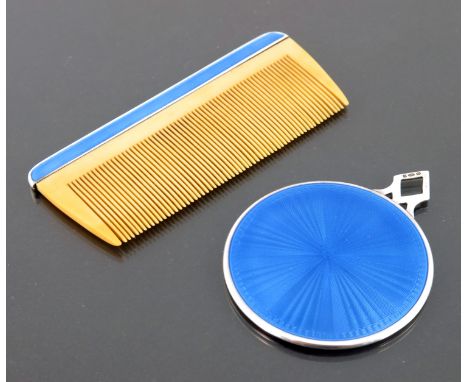 An Art Deco silver and enamelled mirror and comb set, in suede purse, import marks London 1930, the circular mirror with open