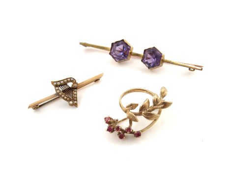Three gold gem-set brooches, to include a split pearl harp brooch, an amethyst two-stone bar brooch and a further brooch, one