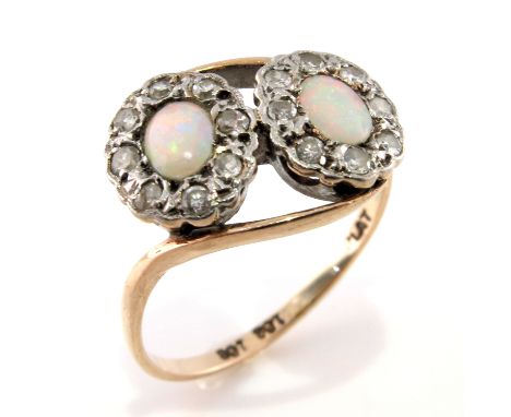 A mid 20th century 9ct gold and platinum, opal cabochon and diamond double cluster ring, stamped 9ct and plat, ring size O, 2