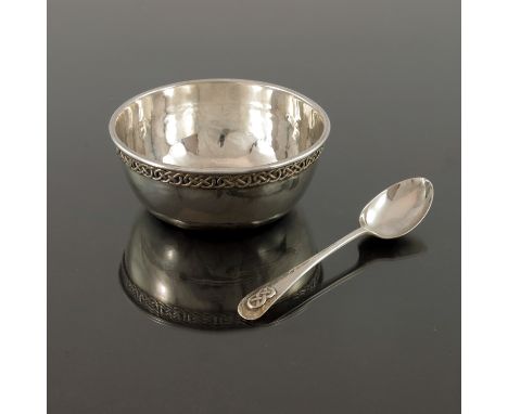Liberty and Co., an Arts and Crafts silver bowl and spoon, Birmingham 1926, planished and applied with a Celtic knot band, th