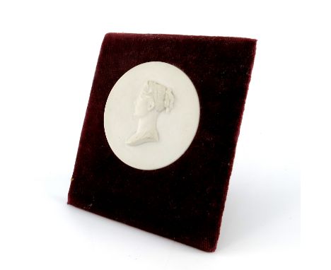 A Sevres bisque porcelain portrait medallion of Josephine Bonaparte, modelled in profile facing left, circular, mounted on ve
