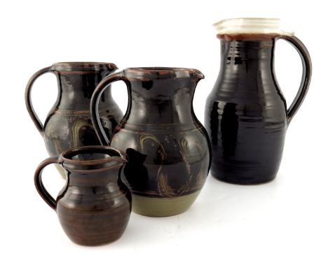 Matt Grimmitt and John Foster for Winchcombe, a collection of studio pottery jugs, including a pair by Foster, bulbous form w