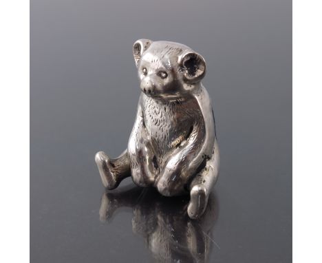 An Edwardian novelty silver pin cushion, W J Myatt and co., Chester 1909, modelled as a teddy bear, in seated position, origi