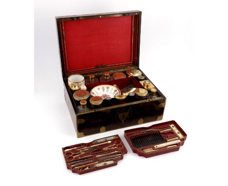 A Napoleonic Imperial French Palais Royal travelling compendium, circa 1805, the brass mounted burr walnut box containing ful