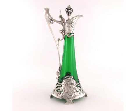 WMF, a Jugendstil silver plated and glass claret jug, the green trumpet form body mounted with open tendril and relief moulde