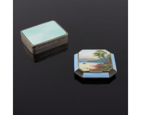 A gilt metal octagonal enamel powder compact with a river landscape to the hinged cover within a blue and black panel border,