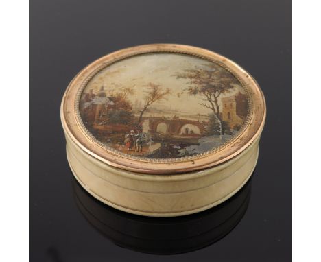 An 18th century gilt metal mounted ivory and tortoiseshell snuff box, the lid glazed and painted with a Romantic landscape af