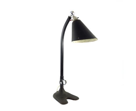 An Art Deco Industrial design gooseneck desk lamp, circa 1935, cast steel stepped base with pen rest and inkwell cavity, bend