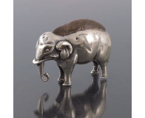 An Edwardian novelty silver pin cushion, Adie and Lovekin, Birmingham 1907, modelled as an elephant with hanging trunk, origi