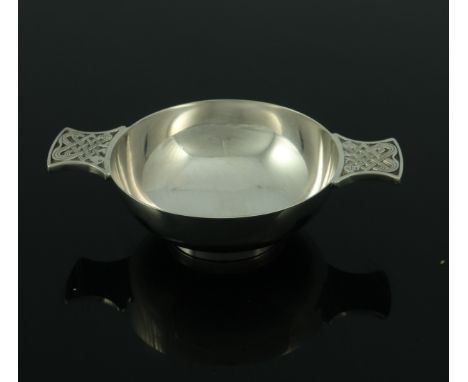 An Elizabeth II Scottish silver quaich, Francis Howard Ltd, Edinburgh 1991, traditional form with cast zoomorphic Celtic knot