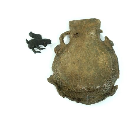 A medieval pilgrim's lead ampulla, circa 14th/15th century, side decorated with possible portrait of the Virgin Mary, one sus