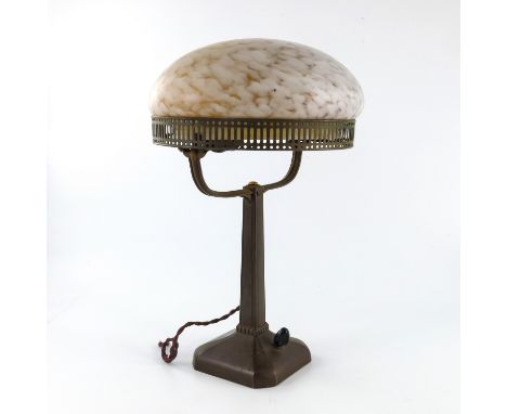 A Jugendstil bronzed metal and glass table lamp, circa 1920s, the marbled glass domed shade supported on a galleried ring rai
