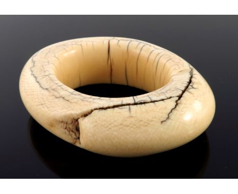 λ An African tribal ivory bangle bracelet, unusually large and heavy, 255 grams, 12cm widest