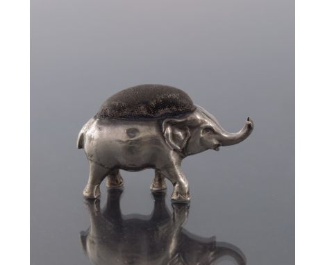 An Edwardian novelty silver pin cushion, Levi and Salaman, Birmingham 1906, modelled as a baby elephant, trunk raised, origin