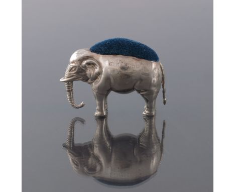 An Edwardian novelty silver pin cushion, Saunders and Shepherd, Birmingham 1905, modelled as an elephant, standing, with hang