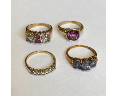 Collection of four 9ct yellow gold gem set rings. To include a mystic topaz and diamond ring, a coated pink stone solitaire r