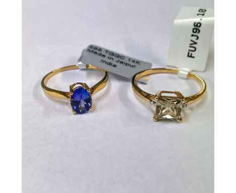 A 14 ct gold diaspore and diamond solitaire ring along with a Tanzanite solitaire ring. The diaspore ring is a size T 1/2; th