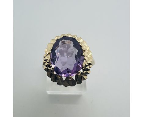 A 9ct gold Amethyst set cocktail ring.&nbsp; Stone measures approximately 12mm x 10mm, size T.&nbsp; Gross weight approximate