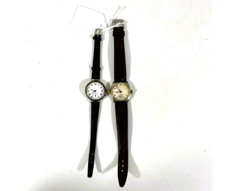 2 Silver manual wind wristwatches on leather straps.&nbsp; Both running