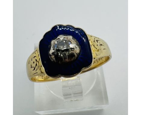 A Victorian mourning ring set with a cut down collet set old mine cut diamond, set into a grand of blue guilloche enamel with
