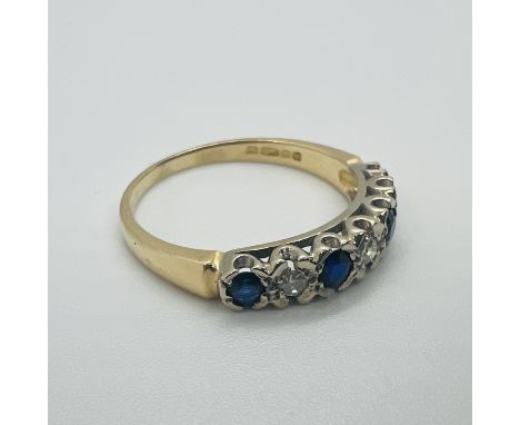 An 18ct yellow gold diamond and sapphire half hoop ring.&nbsp; Size S.&nbsp; Approximate weight 3.7 grams.