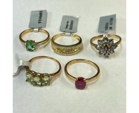 A yellow and white diamond set ring along with four other 9ct gold gem set dress rings. All size R. Gross weight approximatel