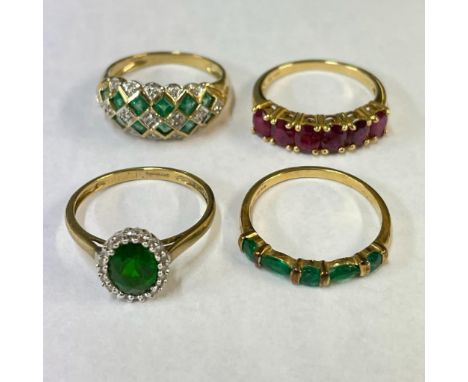 A group of four vibrantly coloured gemstone 9ct gold rings. Featuring a ruby half hoop ring, and emerald and diamond ring, an