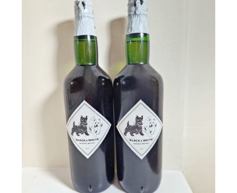 2 bottles of Black and White Buchanan's Special Blend of choice old Scotch Whisky, 70% proof 26 2/3 fl oz.&nbsp; Spring cap s