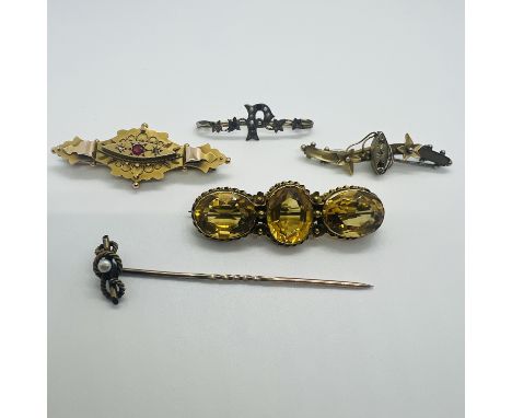 A collection of antique bar brooches. Featuring a Three stone citrine brooch, stamped "15c" and "JP", approximate weight 6.5 