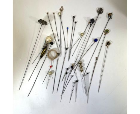 A collection of hatpins to include a sterling silver Charles Horner silver topped thistle pin, a secessionist style&nbsp; sil