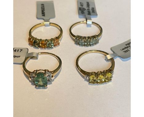 A collection of four 9ct yellow gold gem set rings. Including two with accenting&nbsp; diamonds. Size R 1/2. Gross approximat