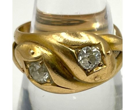 A Victorian double serpent head 18ct gold and diamond ring. Set with two old mine cut diamonds with diameters of approximatel