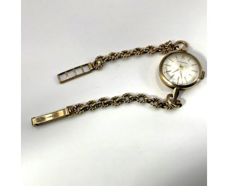 A ladies 9ct gold cocktail watch, by Garrard.&nbsp; Featuring a silvered dial with baton markers, signed Garrard, to a keyles