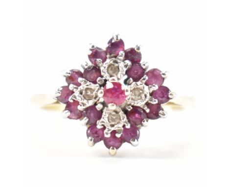 A hallmarked 9ct gold ruby and diamond cluster ring. The ring set with round cut diamonds and four round cut diamonds to the 