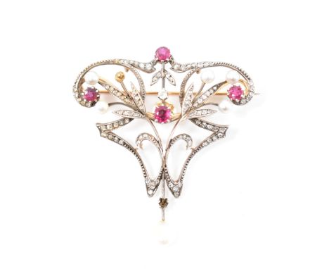 A early 20th Century Art Nouveau diamond, ruby and pearl brooch. The brooch being set throughout with rose cut diamonds, with