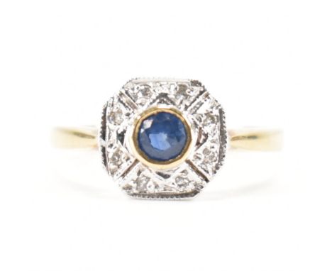 A hallmarked 9ct gold sapphire and diamond ring. The ring set with a round cut sapphire framed by round brilliant cut diamond