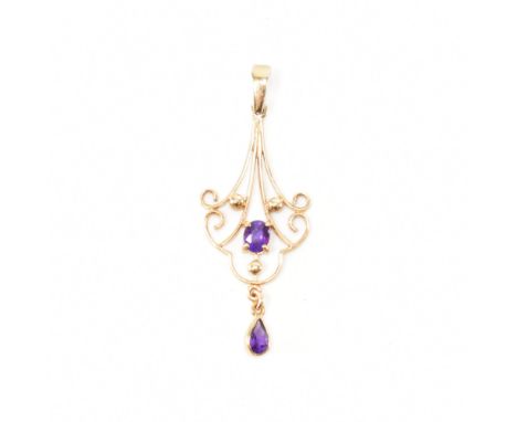 A hallmarked 9ct gold amethyst necklace pendant. The pendant strung with two oval cut amethyst drops in a contemporary Art No