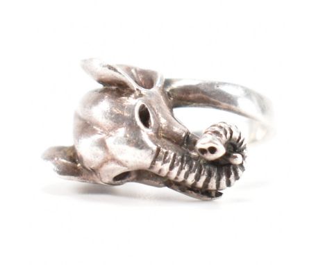 A 925 silver elephant head crossover ring. The ring in the form of an elephant with ears back &amp; trunk curled up with the 