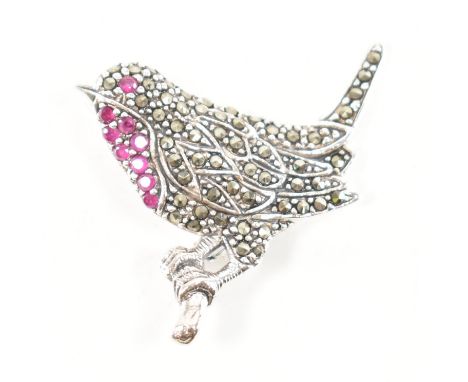 A 925 silver, marcasite &amp; ruby robin brooch. The brooch in the form of a robin bird sat on a branch, set throughout with 