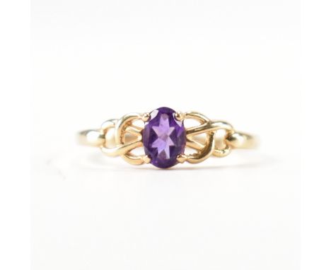 A&nbsp; hallmarked 9ct gold and amethyst ring. The ring set with a central oval cut amethyst in a celtic style mount. Weight 