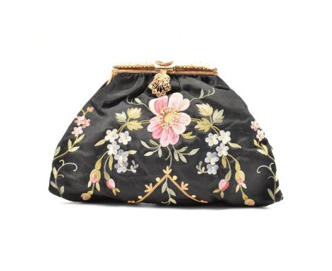 A 1920s Art Deco embroidered silk handbag. The bag having a black silk body with embroidered floral details with a gold tone 