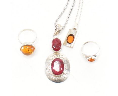 An assortment of silver stone set jewellery. The lot to include; two amber cabochon bezel set rings (sizes P.5 &amp; M.5), an